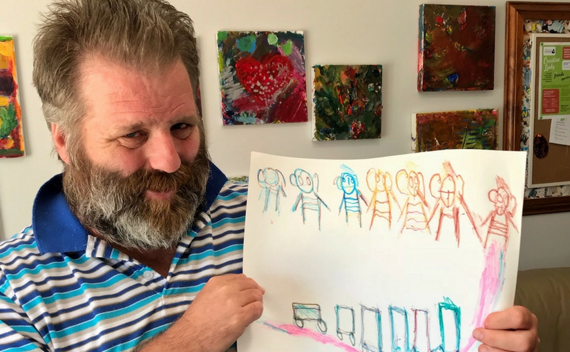 Robbie OBrien at Creative Links with his art work