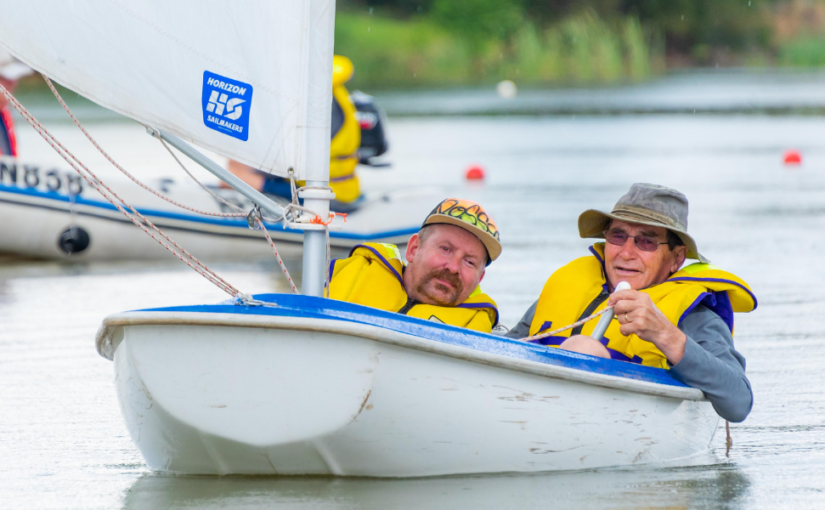 Ross sailing on Lake Weeroona with Sailability. He is making choices in his life with his NDIS plan.